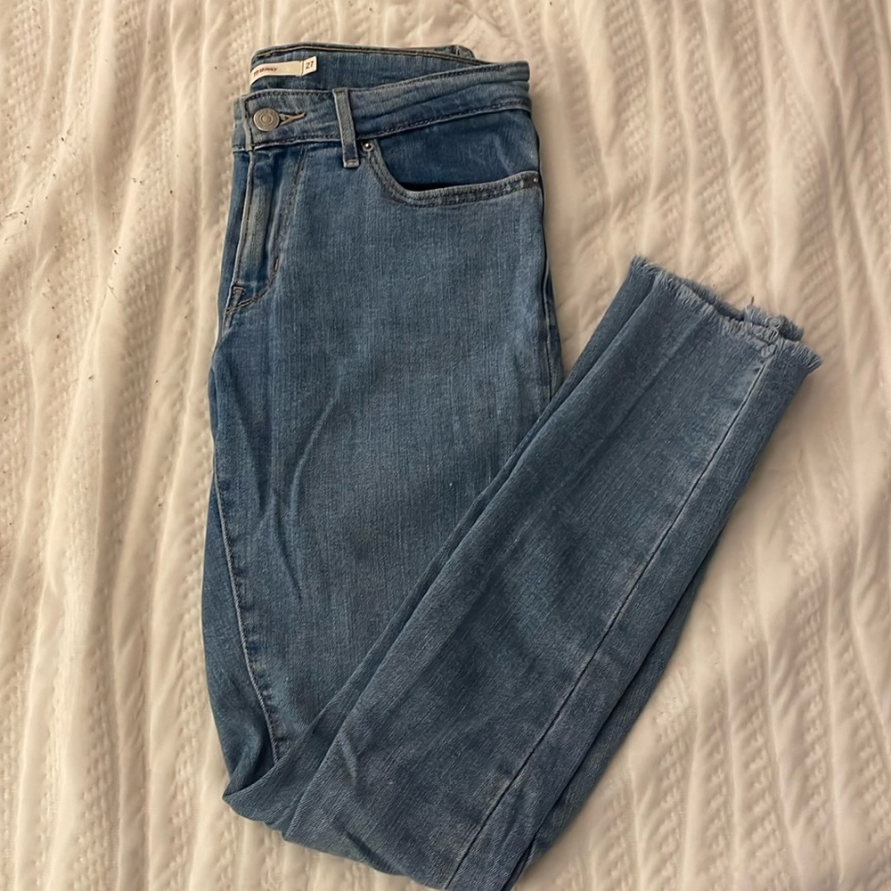 Levi’s women’s skinny jeans with frayed bottoms